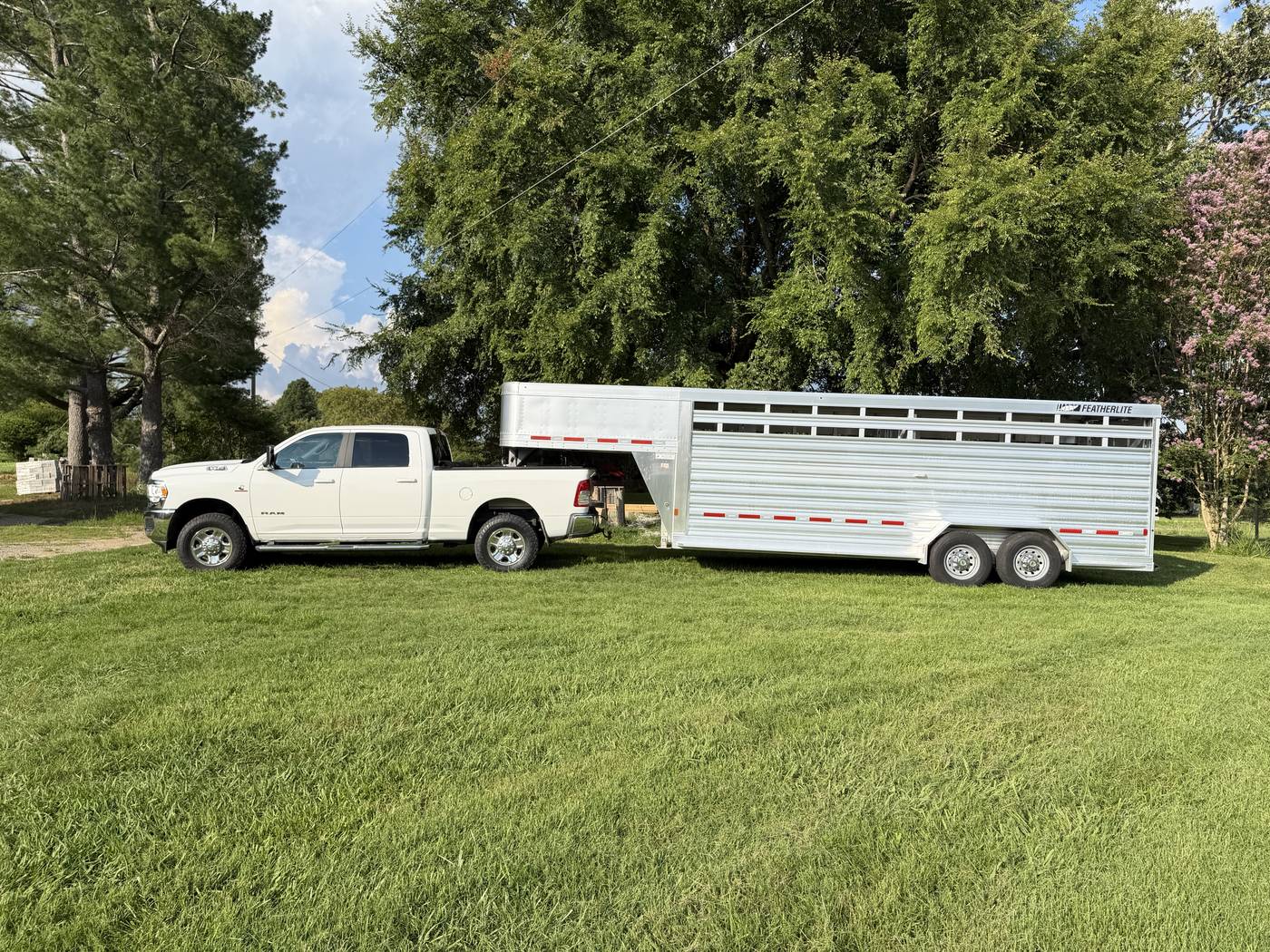 Eco Grazers truck and Featherlite gooseneck livestock trailer used to move the herd between projects